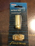 National Polished Brass 2" Surface Bolt With Mortise And Strike. Fixed Price $10.00.